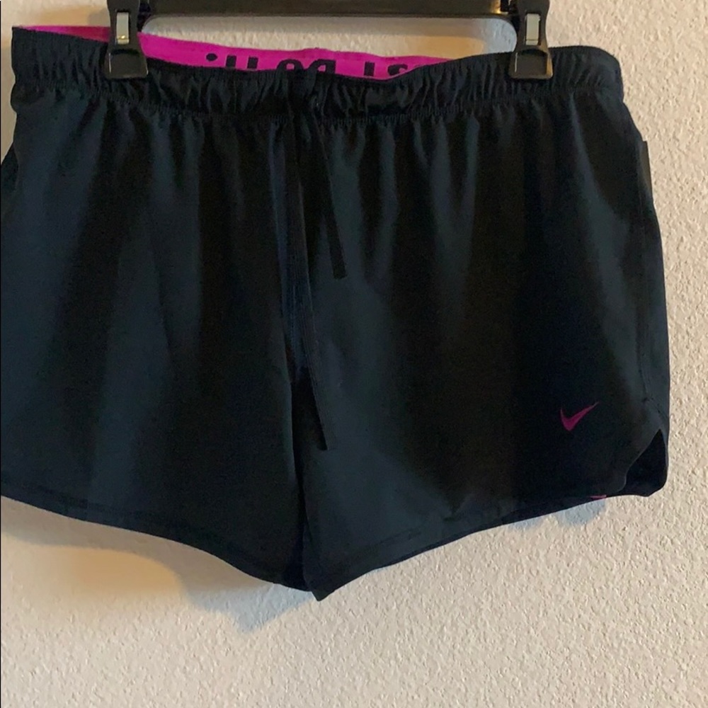 Black and magenta Nike dri fit shorts